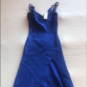 Blue midi dress, high slit.